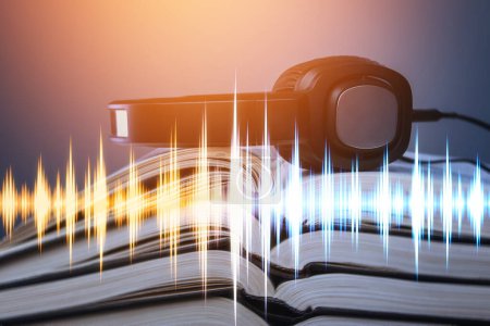 Photo for Real books, headphones and sound waveform. Audiobook listening. - Royalty Free Image