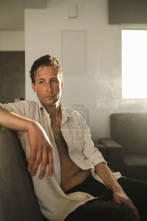 Photo for Portrait of handsome thoughtful man with wet hair at home - Royalty Free Image