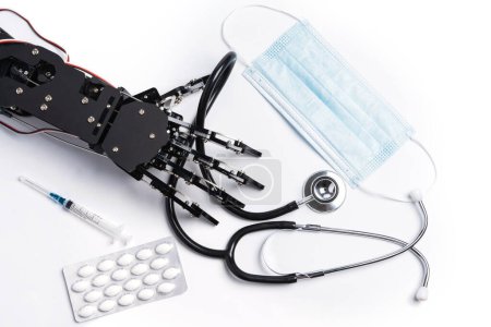 Photo for Real robotic hand with medical equipment and drugs. Concept of Artificial intelligence and robots in medicine. - Royalty Free Image
