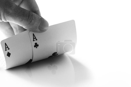 Photo for Monochrome image of male hand with two aces. Concepts of gambling and luck. - Royalty Free Image