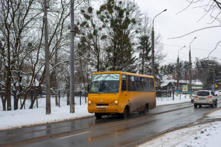 Photo for CHERNIVTSI, UKRAINE - February 05, 2023. Bus I-VAN A07 (TATA) riding with passengers in the streets of Chernivtsi. - Royalty Free Image