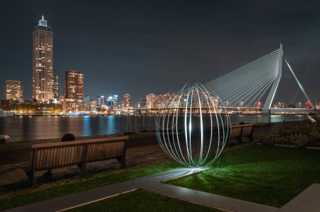 Photo for Light painting at Rotterdam The Netherlands- Erasmusbridge by night - left the Zalmhaven Toren - Royalty Free Image