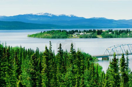 Photo for Alaska Highway and Nisutlin Bay Bridge across Teslin lake in Yukon territory, Canada - Royalty Free Image
