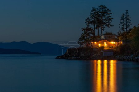 Illuminated idyllic house on one of the San Juan islands, Pacific coast, Washington state
