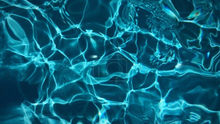 Animated transparent clean blue swimming pool water surface with waves and sunlight glitters. Water background light reflection, pool bottom, moving liquid plastic smooth. 8k wallpaper 4k screensaver.