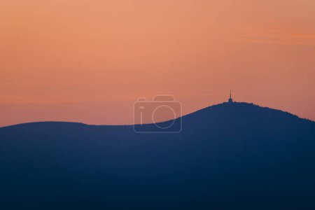 Photo for Radhost is a majestic peak in the Czech Republic Beskydy moutains, a popular pilgrimage site with stunning vistas and a historic statue of the pagan god Radegast. High quality illustration - Royalty Free Image