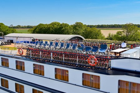 Photo for Veere, Netherlands - August 2022: Rows of electric bicycles on the top deck of a river cruise ship - Royalty Free Image