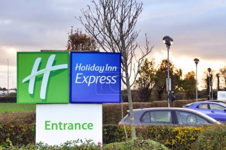 Photo for Rhoose, Wales - November 2022: Sign at the entrance to the Holiday Inn Express airport hotel at Cardiff Wales Airport - Royalty Free Image
