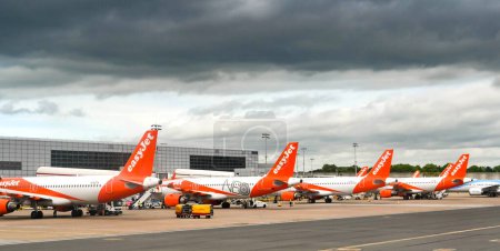 Photo for London, England - May 2022: Row of Easyjet Airbus planes at the airline's Gatwick airport base. - Royalty Free Image