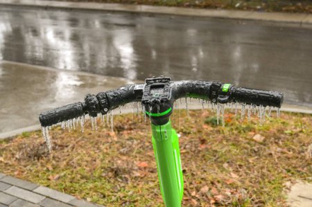 Photo for Austin, Texas, USA - February 2023: Icicles hanging off the handlebars of an electirc scooter after freezing rain fell on the city - Royalty Free Image