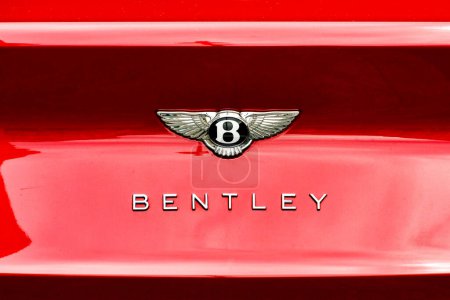 Photo for London, England, UK - 27 June 2023: Close up view of the badge on the reaer of a Bentley luxury car parked on a street in central London,. - Royalty Free Image