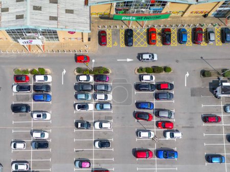 Photo for Llantrisant, Wales, UK - 19 July 2023:  Aerial view of cars parked outside stores in an out of town retail park in south Wales - Royalty Free Image