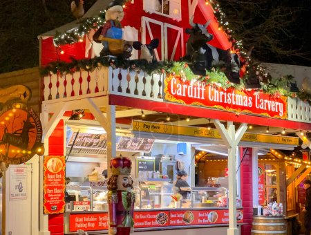 Photo for Cardiff, Wales - 13 December 2023: Food stall in the city's Christmas market - Royalty Free Image