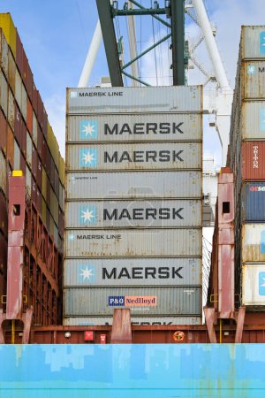 Photo for Miami, Florida, USA - 1 December 2023: Shipping containers stacked high on the side of a container cargo ship in Miami docks - Royalty Free Image