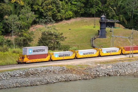 Photo for Panama - 22 January 2024: Freight train of wagions carrying shipping containers on the Panama Canal Railway - Royalty Free Image