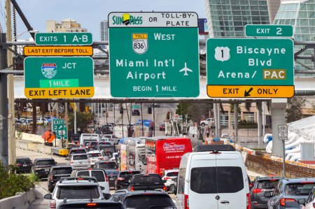 Photo for Miami, Florida, USA - 27 January 2024: Signs above on the main roads in the city of Miami congested with traffic - Royalty Free Image