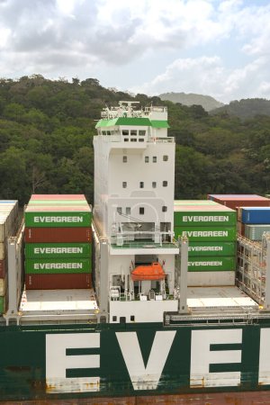 Photo for Panama Canal, Panama - 23 January 2024: Shipping containers stacked either side of the bridge of a large container ship - Royalty Free Image