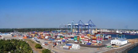 Photo for Puerto Quetzal, Guatemala - 19 January 2024: Panoramic view of shipping containers in the city's port with container cranes in the background - Royalty Free Image