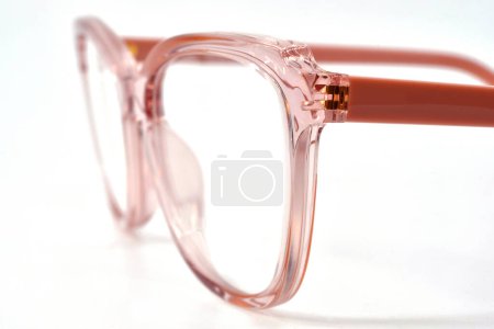 Photo for Close up view of a pair of pink framed glasses isolated on plain white background. - Royalty Free Image