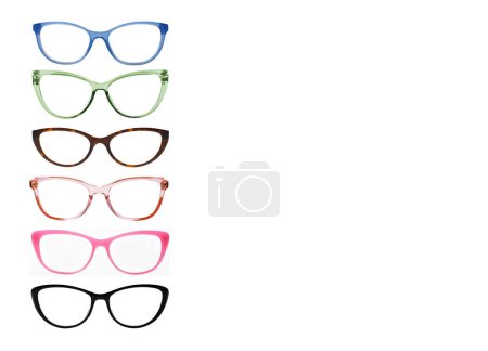Front view of glasses frames in a range of birght colours and different shapes isolated on a plain white background. Copy space.