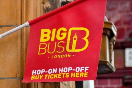 Photo for London, England, UK - 28 June 2023: Flag advertising a ticket counter for the Big Bus tourist sightseeing bus company in central London - Royalty Free Image