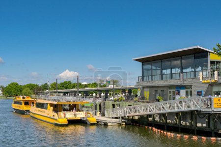 Photo for Washington DC, USA - 3 May 2024: Yellow water taxis moored at the jetty  of the Wharf development on the Potomac River - Royalty Free Image