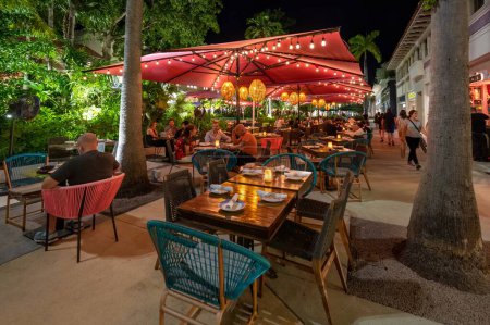 Photo for Miami Beach, Florida - May 1, 2023 - Outdoor restaurants on Lincoln Road Mall at night. - Royalty Free Image