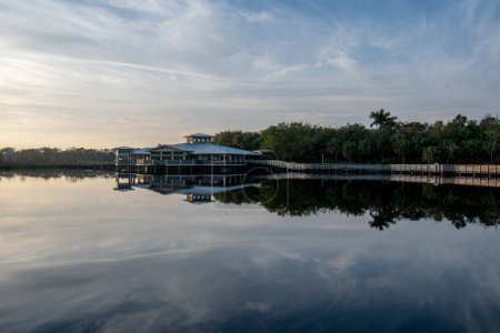 Boardwalk and visitor center at Green Cay Nature Center and Wetlands in Boynton Beach, Florida at sunrise.