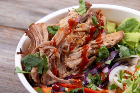 Photo for Delicious pulled pork loaded ramen bowl dish closeup with veggies - Royalty Free Image