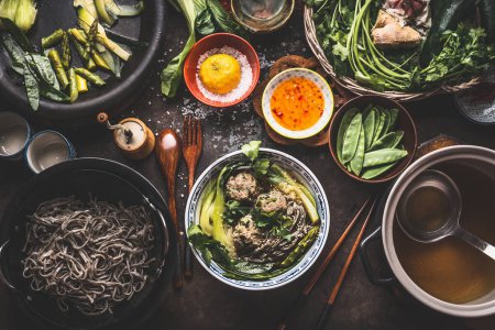Asian food,Tasty ,noodle soup ,vegetables ,meat ,balls ,bowl, topped ,sesame, seeds ,chili ,rustic, kitchen ,table ,ingredients,herbs, vegetables ,spices,Asian cuisine ,concept