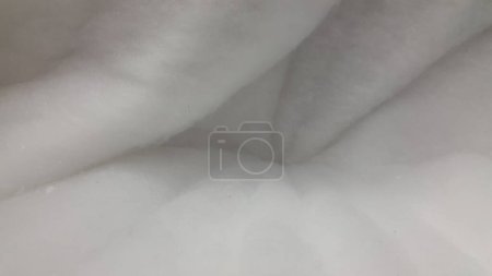 Fluffy texture. Soft white fluffy surface. Fuzzy background