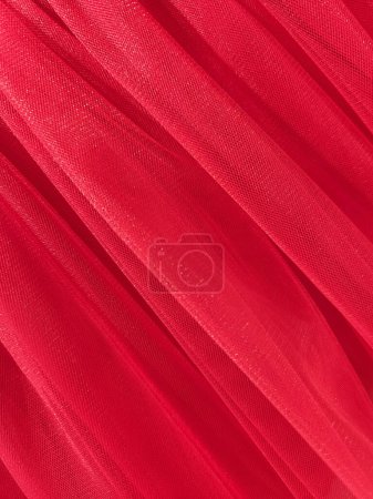Red mesh fabric. Red fabric background. Factory texture