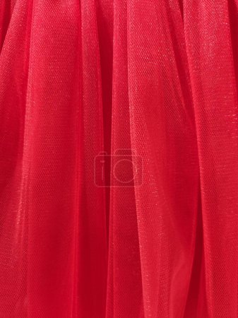 Red mesh fabric. Red fabric background. Factory texture