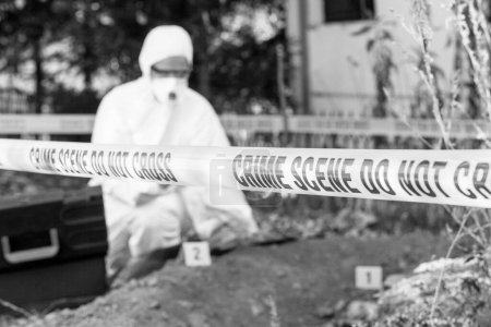 Photo for Crime scene investigation. Forensic science specialist working on human remains identification. - Royalty Free Image