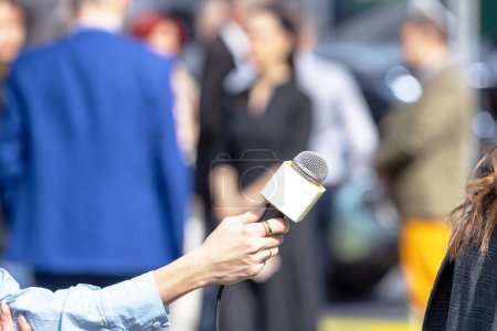 Reporter making media interview with unrecognizable female person