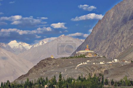 Photo for Statue of Buddha near Diskit Monastery in Nubra Valley, Ladakh, India. It is a 32 metre statue facing down the Shyok River towards Pakistan. - Royalty Free Image