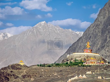 Photo for Statue of Buddha near Diskit Monastery in Nubra Valley, Ladakh, India. It is a 32 metre statue facing down the Shyok River towards Pakistan. - Royalty Free Image