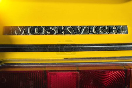 Photo for Moskvich logo on the trunk of a ussr yellow retro Moskvich car, close-up. Almaty, Kazakhstan - May 02, 2022 - Royalty Free Image