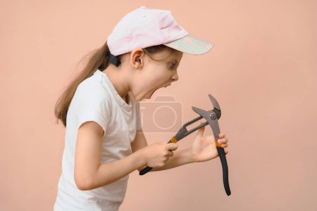 Photo for The child can not cope with the instrument and he is angry with him. Anger management in children. - Royalty Free Image