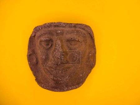 Photo for Mexican Mayan Aztec wood and ceramic mask on yellow background travel image Mexico Tenochtitlan, Teotihuacan. - Royalty Free Image