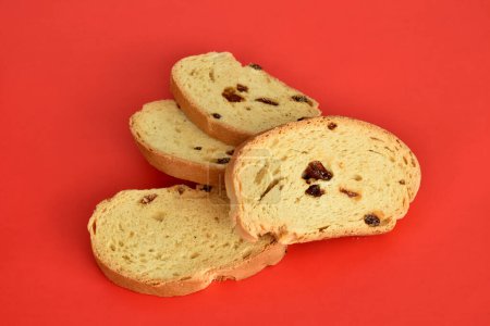 Photo for Sweet dry crackers with raisins lie on a red background. - Royalty Free Image