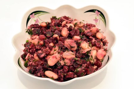 A salad consisting of beets, beans and pieces of tuna fish. Hearty breakfast.