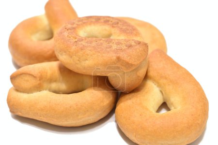 Close-up of bagels lying on a white background.