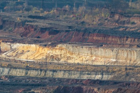 Téléchargez les photos : Bright distant quarry landscape at the daylight. Mining iron ore breed. Ukrainian industrial scape - en image libre de droit