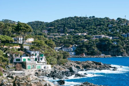 Many houses and apartments built in a beautiful coastal landscape with quiet waters in Costa Brava, Catalonia, Mediterranean Sea
