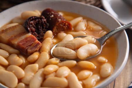 Close up of a spanish white bean stew called fabada