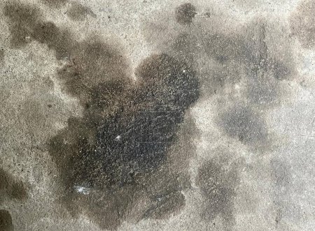 Photo for A photography of a dirty floor with a black substance on it, area of cement with a black substance on it. - Royalty Free Image