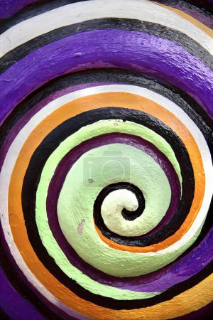 Photo for A photography of a colorful swirl painted on a wall, painting of a colorful swirl with a black background. - Royalty Free Image
