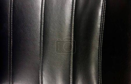 Photo for A photography of a close up of a black leather seat, a close up of a black leather seat with a stitching pattern. - Royalty Free Image
