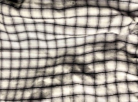 Photo for A photography of a black and white photo of a plaid shirt, shower curtain with a black and white checkered pattern on it. - Royalty Free Image
